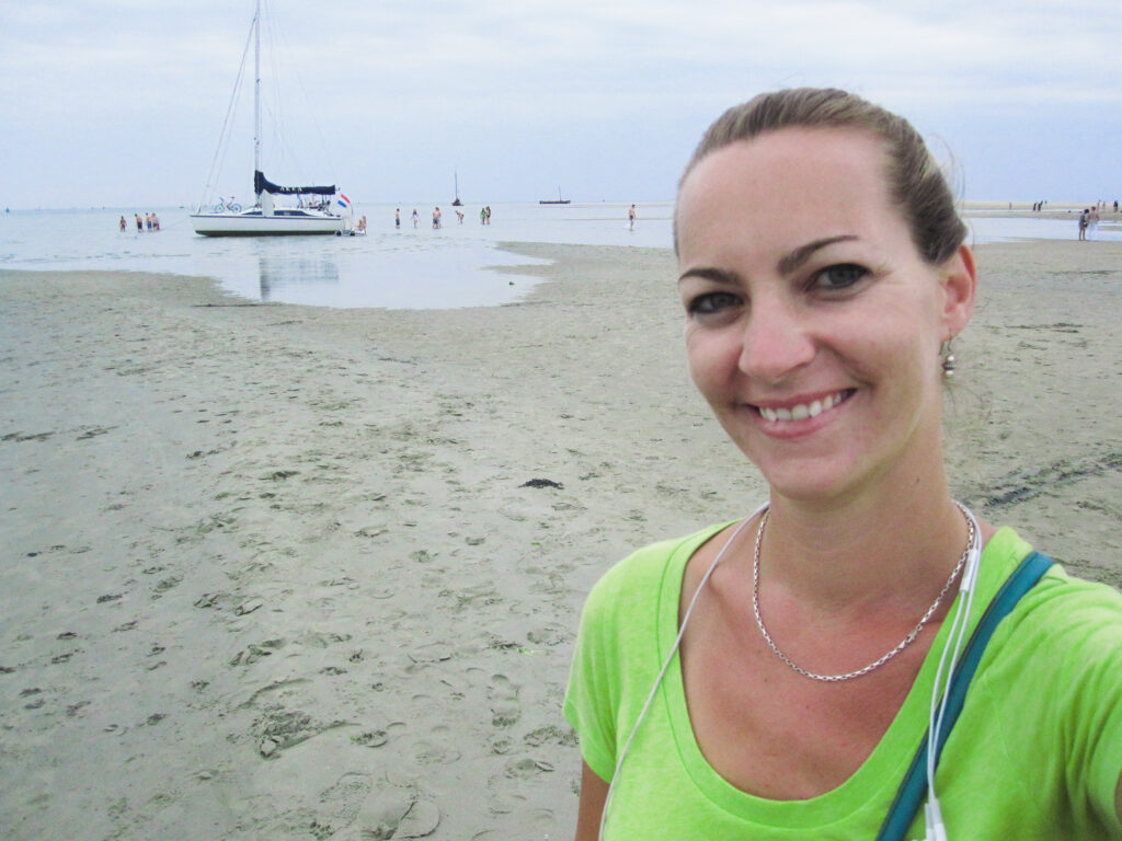 Becky in front of waders in the Wadden Sea